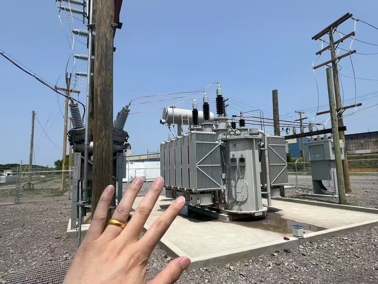 Distribution transformer installed beside a North American utility line